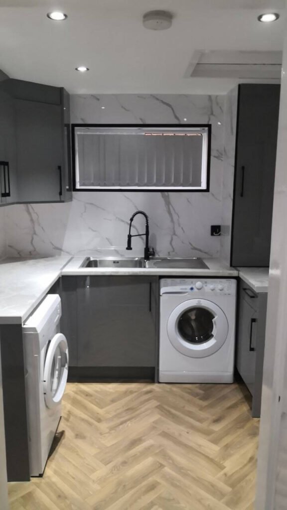 Kitchen refurbishment in Salford with marble worktop by Renovat Construction