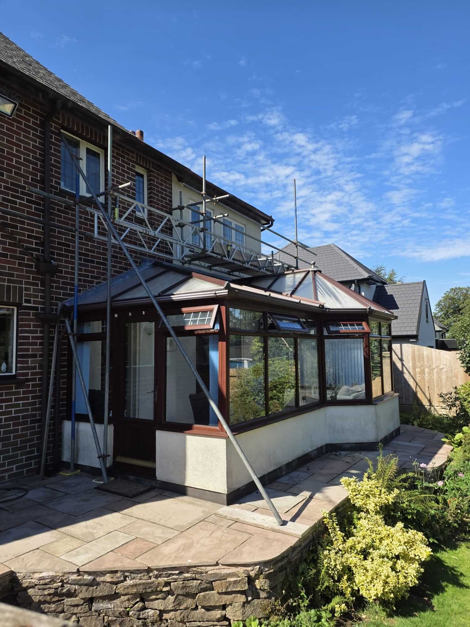 External render and masonry repair works in progress on a residential property in Manchester