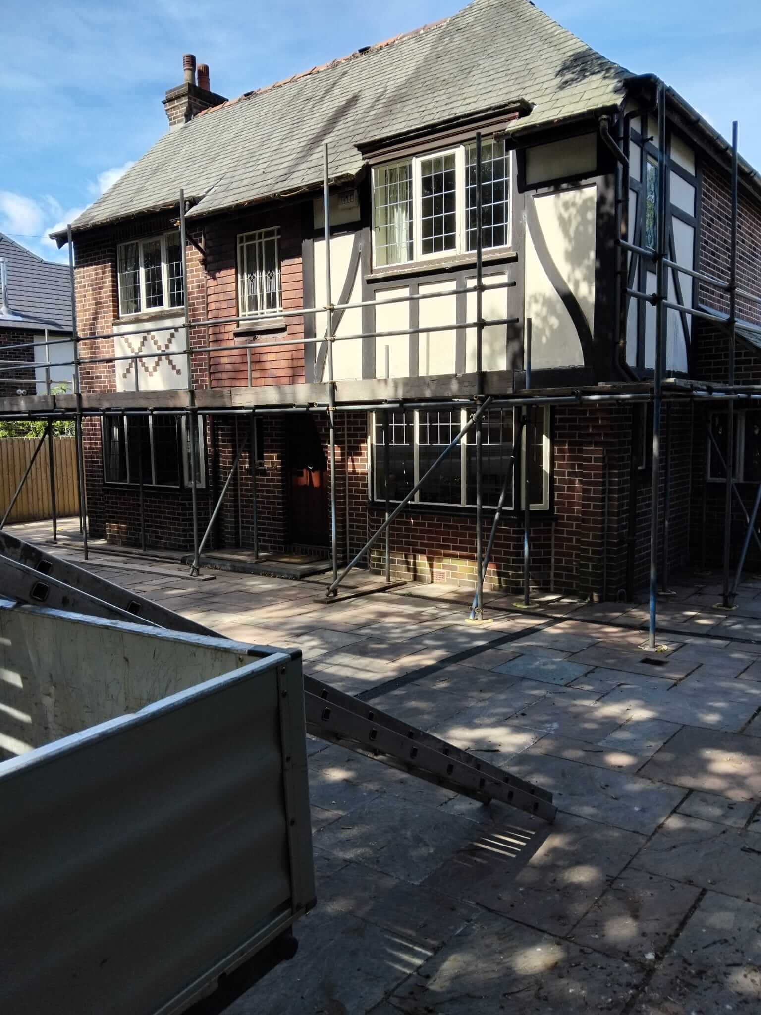 Full scaffold erected to the elevation of a 1930s property in Manchester ahead of external render and brickwork repairs